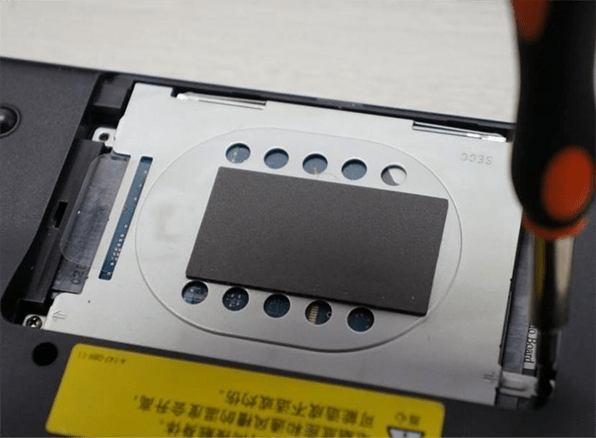 remove the screws fixing the hard disk with a screwdriver